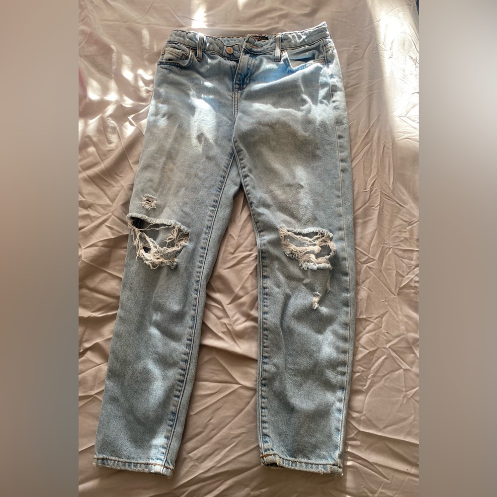 Light blue ripped jeans, size 11/12 for girls